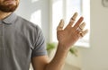 Close up of man& x27;s hand wearing adjustable splint braces on injured or broken fingers. Royalty Free Stock Photo