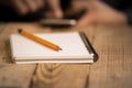 Close Up on a man`s hand writing on paper with a pencil Royalty Free Stock Photo