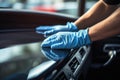 Close up of a man's hands in blue gloves cleaning car interior, Male Worker hand close up Cleaning Car, AI Generated