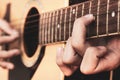 Close up a man`s hands Capturing guitar chords. Playing acoustic guitar at a recording studio Royalty Free Stock Photo
