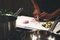 Close up of man`s hands cutting onions on a chopping board Royalty Free Stock Photo