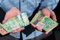 Close-up of man`s hands holding Canadian cash for RRSP and TFSA investments Royalty Free Stock Photo