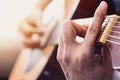 Close up of man`s hands playing acoustic guitar Royalty Free Stock Photo