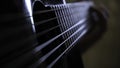 Close-up of man's hands playing on black acoustic guitar. Concept. Concept of music lessons Royalty Free Stock Photo