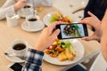 Close-up Man`s hands Taking Picture Of Food With Mobile smart Phone Royalty Free Stock Photo