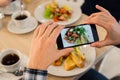 Close-up Man`s hands Taking Picture Of Food With Mobile smart Phone Royalty Free Stock Photo