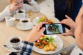 Close-up Man`s hands Taking Picture Of Food With Mobile smart Phone Royalty Free Stock Photo