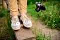 Close up of man`s legs in keds standing on desk. Royalty Free Stock Photo