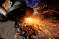 A close-up of a car mechanic using a metal grinder Royalty Free Stock Photo