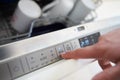 Close Up Of Man Setting Economy Cycle On DishwasherÃ¯Â¿Â½