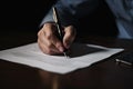 Close-up of a man signing a contract with a pen. A real estate agent signing his documents closeup, AI Generated Royalty Free Stock Photo