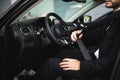 Close-up of man sitting in car fastening seat belt Royalty Free Stock Photo