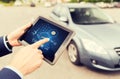 Close up of man with tablet pc diagnoses car Royalty Free Stock Photo