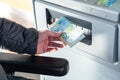 Close up of man taking cash, euros from ATM Royalty Free Stock Photo