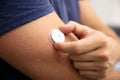 Man Testing Glucose Level With A Continuous Glucose Monitor Royalty Free Stock Photo