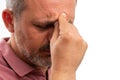 Close-up of man touching forehead as stressed thinking gesture