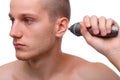 Close-up of a man with a trimmer near his ear isolated on white background Royalty Free Stock Photo
