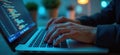 Close-up of man typing code on laptop. Fingers press keyboard buttons. Concept for coding, hacking, data stealing, cyber