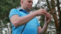 Close-up of man unravel the fishing line