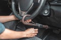 Close up of man use key locking steering wheel for security, Anti thief steal a car, Selective focus