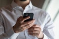 Close up of man use modern cellphone browse internet