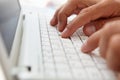 Close up man using computer keyboard