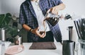 Close up Man using italian classic Moka coffee pot pouring, coffee make with equipment tool brewing table