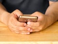 Close up of a man using mobile smart phone.A man hands holding t Royalty Free Stock Photo