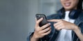 Close up of a man using mobile smart phone. Young Man finger touching on mobile phone screen