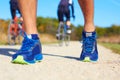 Close up of man walking in nature with biker in background Royalty Free Stock Photo