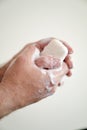 Close up of man washing his hands with a bar of soap and soapy suds Royalty Free Stock Photo