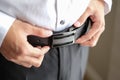 Close up of man wearing waist belt