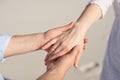 Close-up man and woman hand touching holding together on blurred background for love and healing concept.