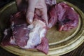 Close-up of a man's bloody hand with a piece of raw meat. An adu Royalty Free Stock Photo