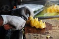 Close-up on man& x27;s hands slicing fresh pineapple Royalty Free Stock Photo