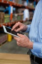 Close up of manager hands using a tablet