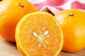 Close up of Mandarin Oranges isolated on wooden background