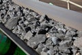Close up of Manganese rock on a conveyor belt