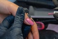 Close-up manicure process, female hands painting nails