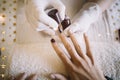 Close-up of manicurist hands in rubber gloves working