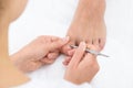 Close-up Of Manicurist Removing Cuticle From The Nails