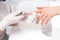 Close up of manicurist using manicure cutter Royalty Free Stock Photo