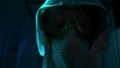 Close-up of mannequin in protective suit. Stock footage. Creepy eyes of mannequin are visible in protective glasses and