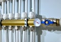 Close up of manometer, pipe, flow meter, water pumps and valves of heating system in a boiler room at home. Royalty Free Stock Photo