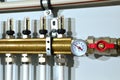 Close up of manometer, pipe, flow meter, water pumps and valves of heating system in a boiler room at home. Royalty Free Stock Photo