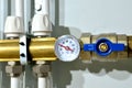 Close up of manometer, pipe, flow meter, water pumps and valves of heating system in a boiler room at home. Systems of water floor Royalty Free Stock Photo