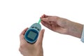 Close-up of mans hand testing blood sugar with glucometer Royalty Free Stock Photo