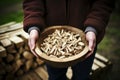 Close up of a mans hands holding eco friendly wood pellets, a renewable heating solution