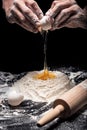Close up of mans hands preparing dough on black background Royalty Free Stock Photo