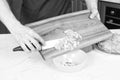 Close up of mans hands putting cut pepper in a bowl Royalty Free Stock Photo